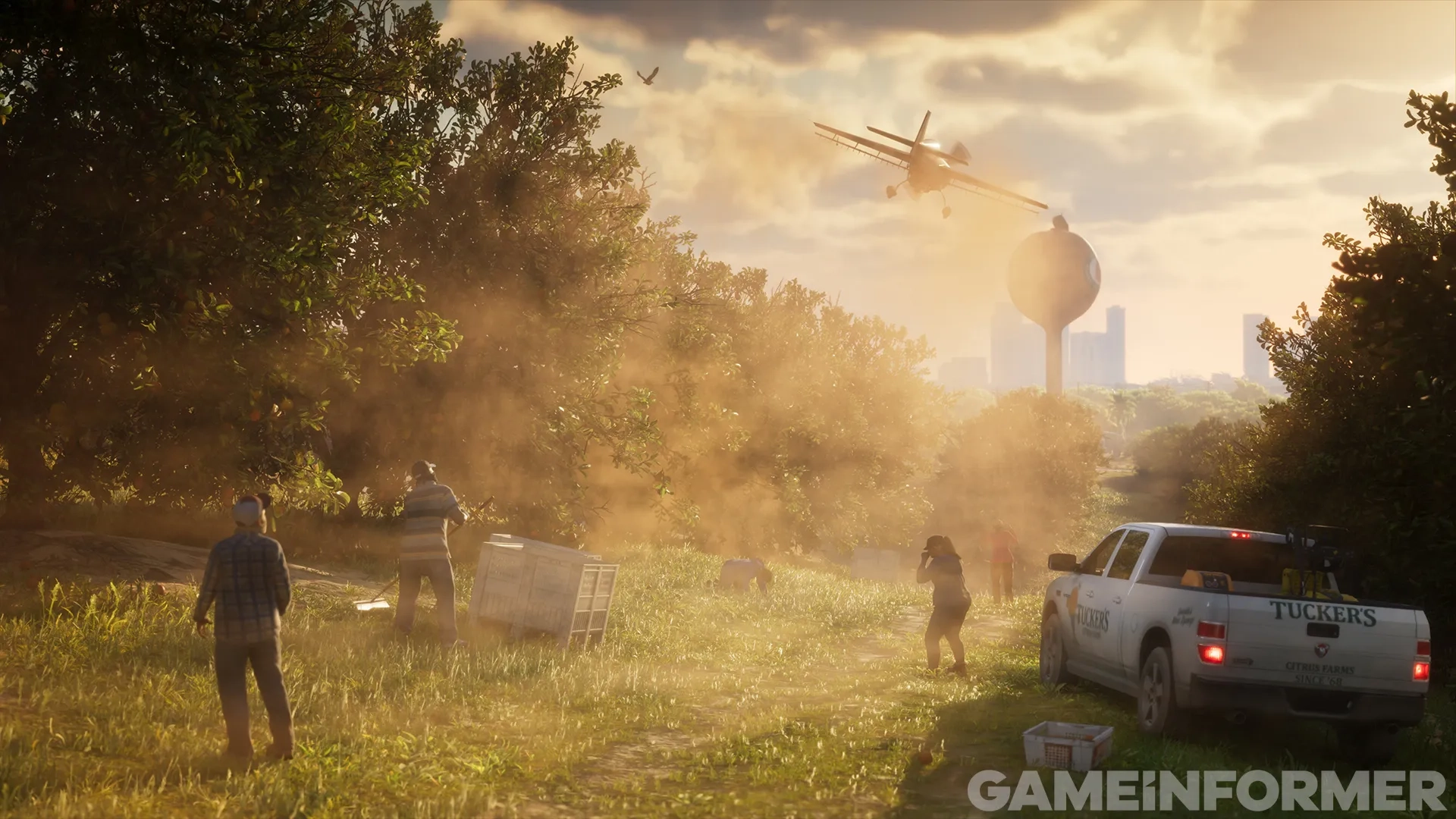 A crop duster plane spraying dust low over an orchard in Grand Theft Auto VI, with farm workers, a white Tuckers pickup truck, and a water tower in the background.
