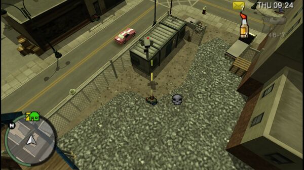 Местоположение камеры безопасности №13 для уничтожения в GTA Chinatown Wars, находится на контейнере рядом с завалом в Истоне.