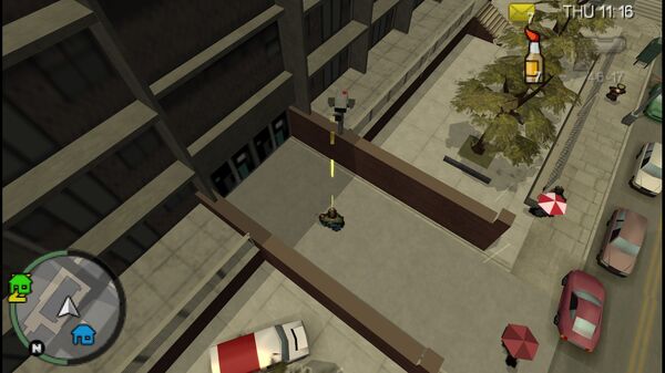 Местоположение камеры безопасности №19 для уничтожения в GTA Chinatown Wars, находится на заборе рядом с входом в здание возле Castle Garden City.