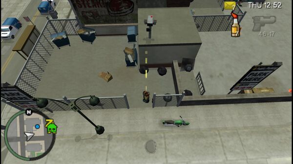 Местоположение камеры безопасности №21 для уничтожения в GTA Chinatown Wars, находится на крыше небольшого здания внутри свалки.