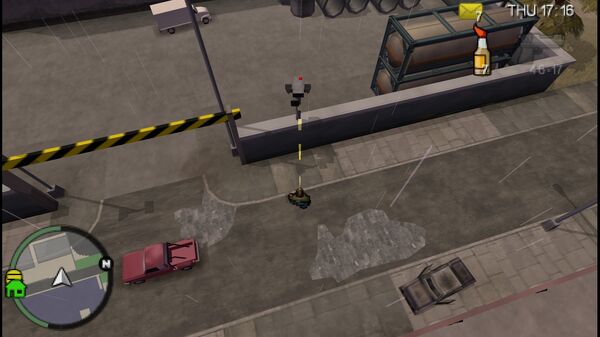 Расположение камеры безопасности №61 для уничтожения в GTA Chinatown Wars, находится у входа на склад в Восточном Индастриале, Бохан.