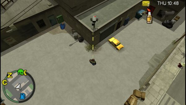 Местоположение камеры безопасности №85 для уничтожения в GTA Chinatown Wars, находится на крыше низкого здания в East Island City.